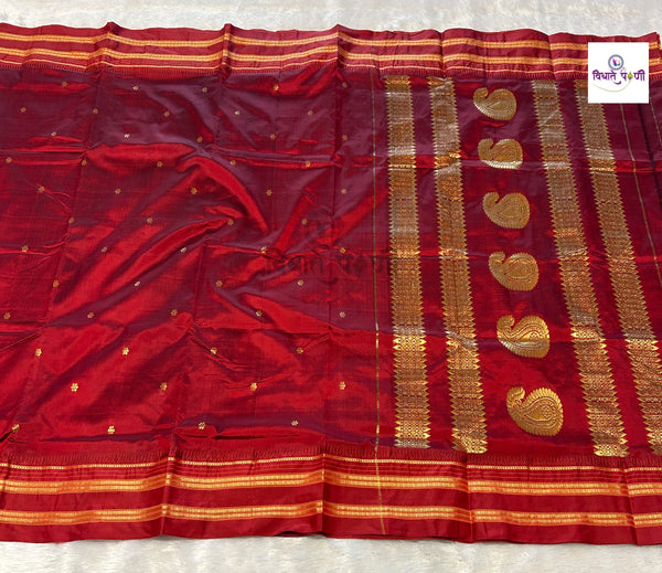 Reddish maroon Narayanpeth single ply pure silk saree with zari buttis and a mango motif pallu
