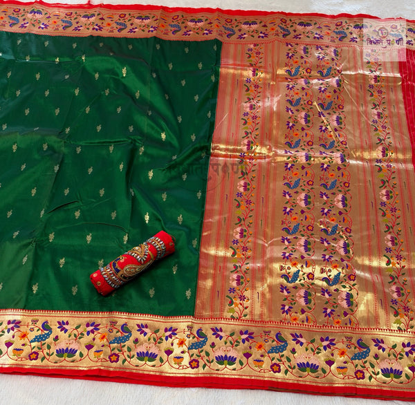 Rajhauns Semi Paithani Saree in Bottle Green with gold floral pallu and designer red Aari work blouse