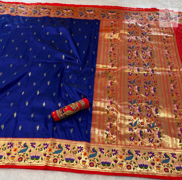 Rajhauns Semi Paithani Saree in Royal Blue with gold floral pallu and designer red Aari work blouse