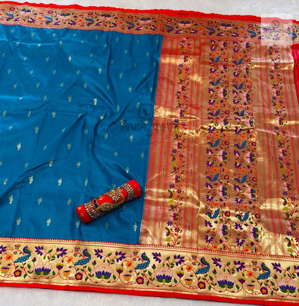 Rajhauns Semi Paithani Saree in Sky Blue with gold floral pallu and designer red Aari work blouse
